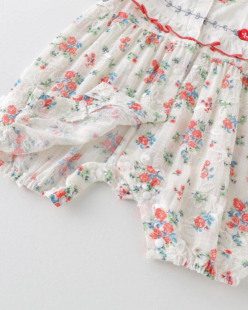 Baby romper with floral pattern