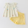 Cream-colored flutter sleeve top and matching set for girls