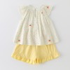 Cream-colored flutter sleeve top and matching set for girls