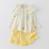 Cream-colored flutter sleeve top and matching set for girls
